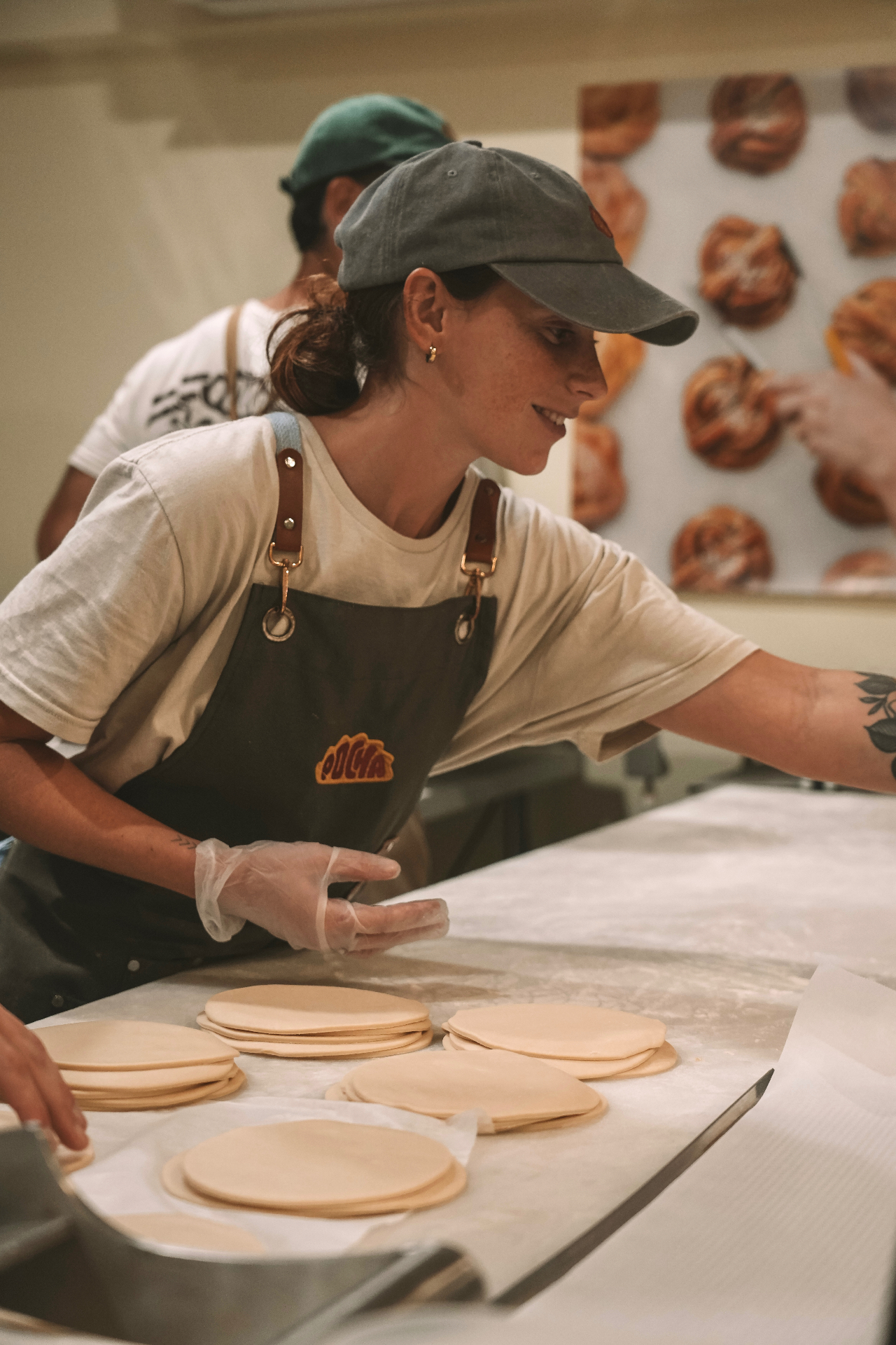 Preparing fresh empanada discs in the Pocha kitchen